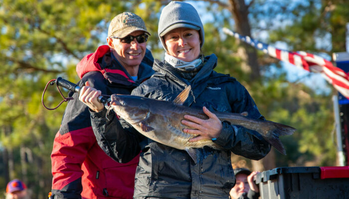 women with large catfish