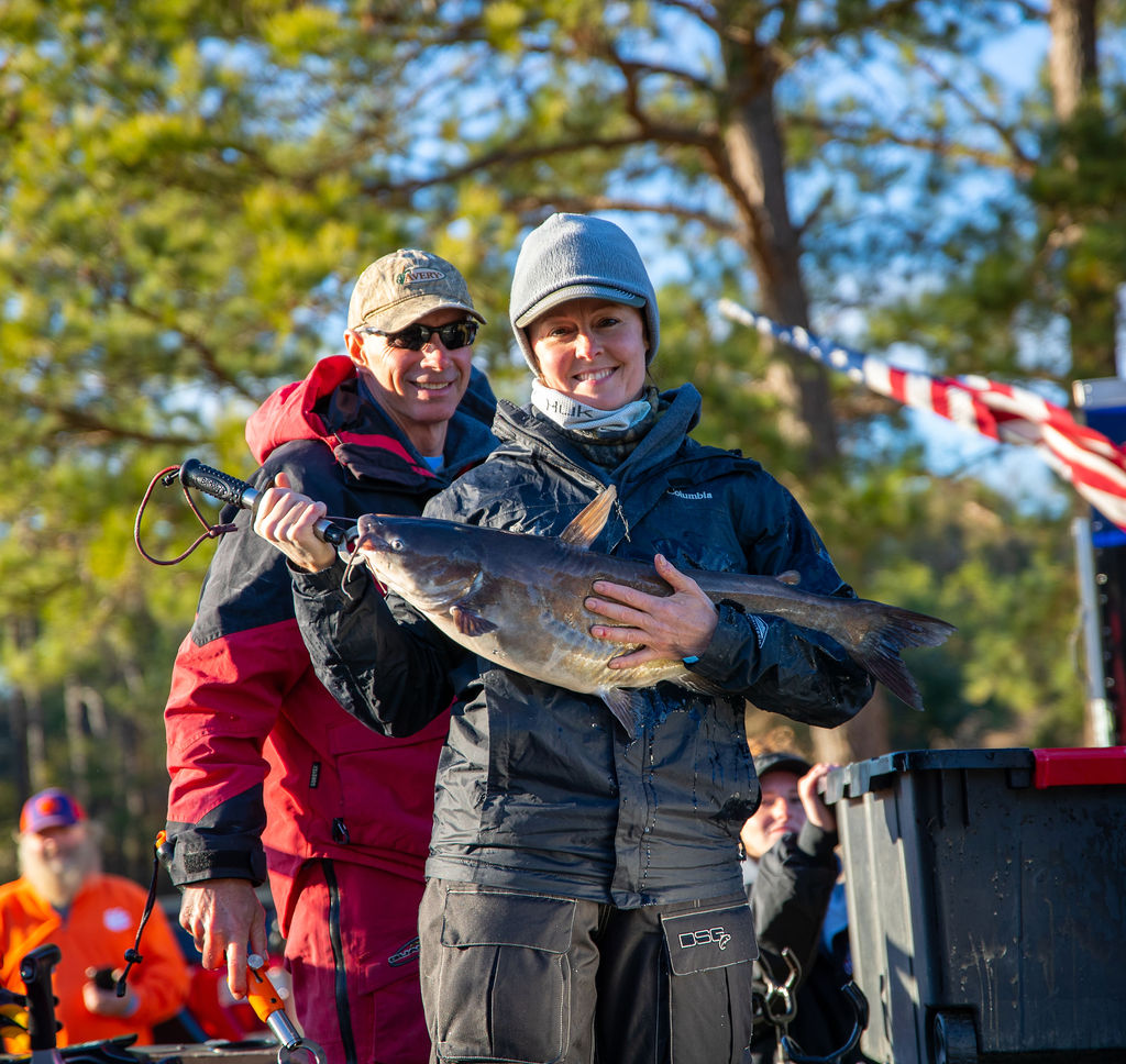 women with large catfish